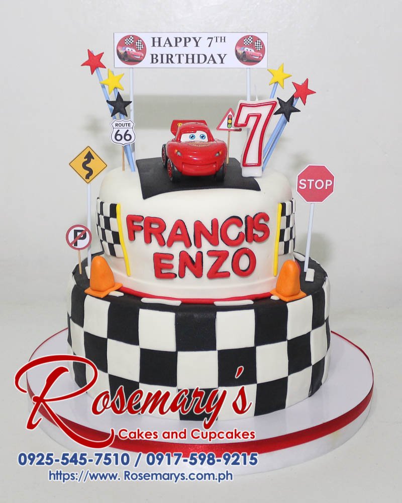 Delicious two-tier black and white car themed cake with Lightning McQueen details. Order your custom cake from Rosemary's Cakes: 0917-598-9215.