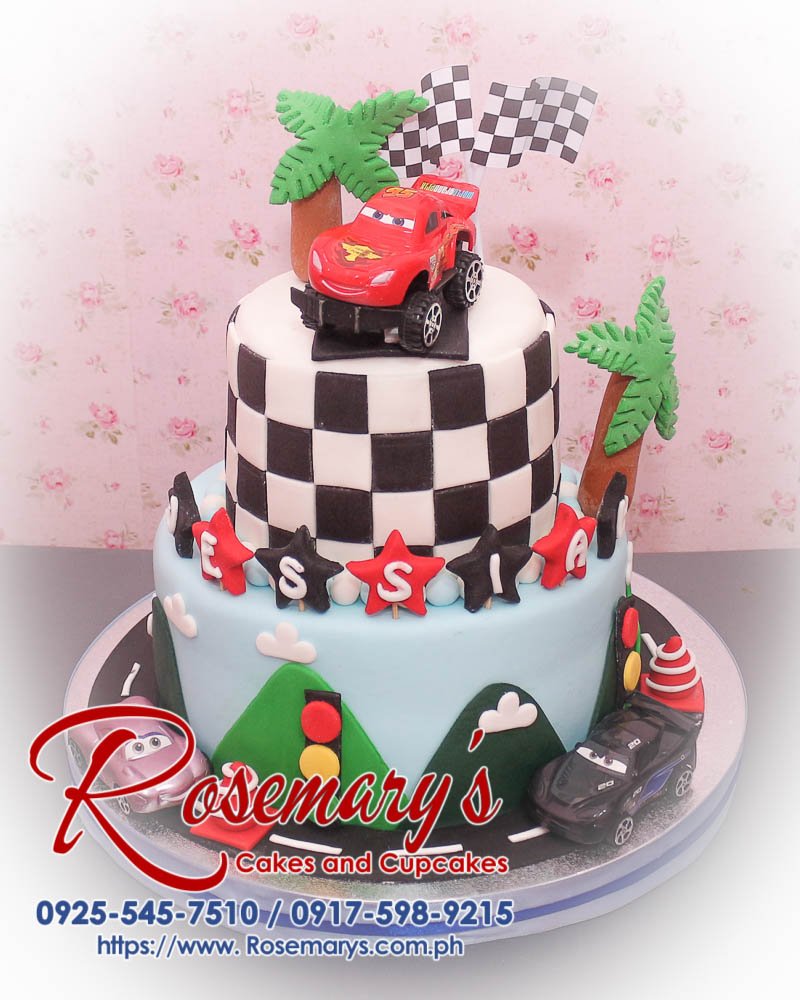 A delicious 2 layer cars themed cake with a chequered design, crafted by Rosemary's Cakes. Contact: 0925-545-7510.