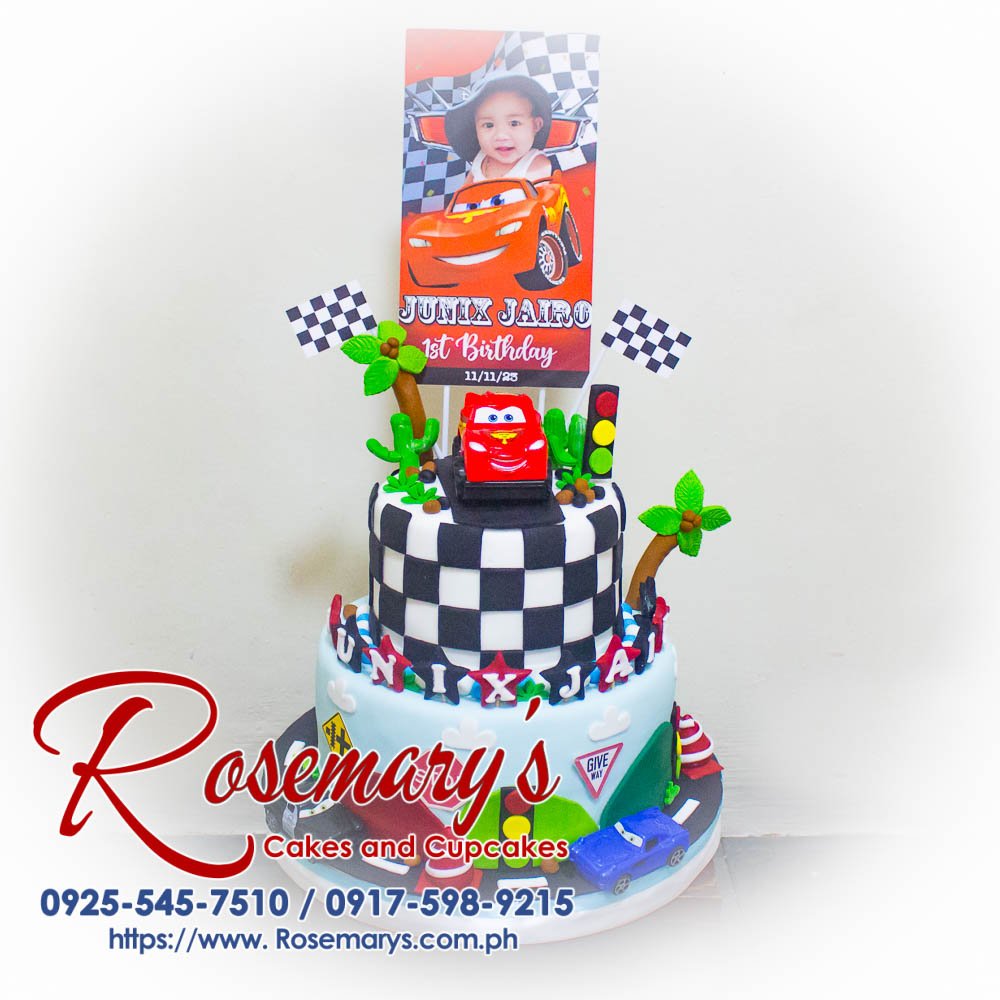 Delicious 2-layer Cars themed cake featuring Lightning McQueen, perfect for celebrations. Order from Rosemary's Cakes at 0925-545-7510.