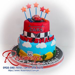 Decadent 2-layer cars themed cake in blue and red featuring Lightning McQueen, crafted by Rosemary's Cakes. Contact: 0925-545-7510.