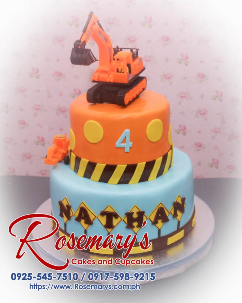 2 Layer Construction Themed Cake for Nathan Delicious 2 layer construction themed cake in blue and orange by Rosemary's Cakes - contact 0925-545-7510.
