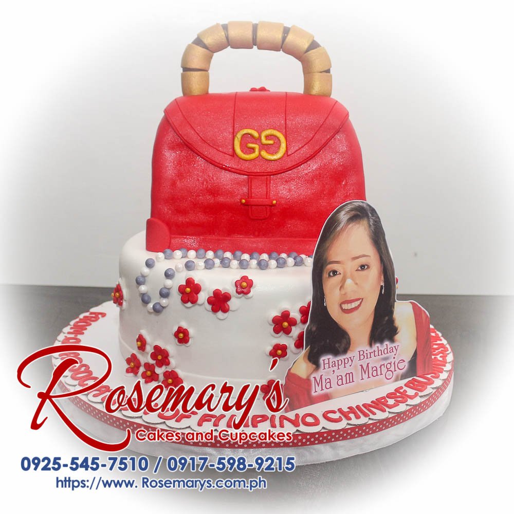 Delicious 2 layer designer bag themed cake in red, perfect for any occasion. Crafted by Rosemary's Cakes - Contact: 0925-545-7510.