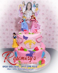 Delicious 2 layer Disney princess themed cake in pink, beautifully decorated. Order from Rosemary's Cakes: 0925-545-7510.