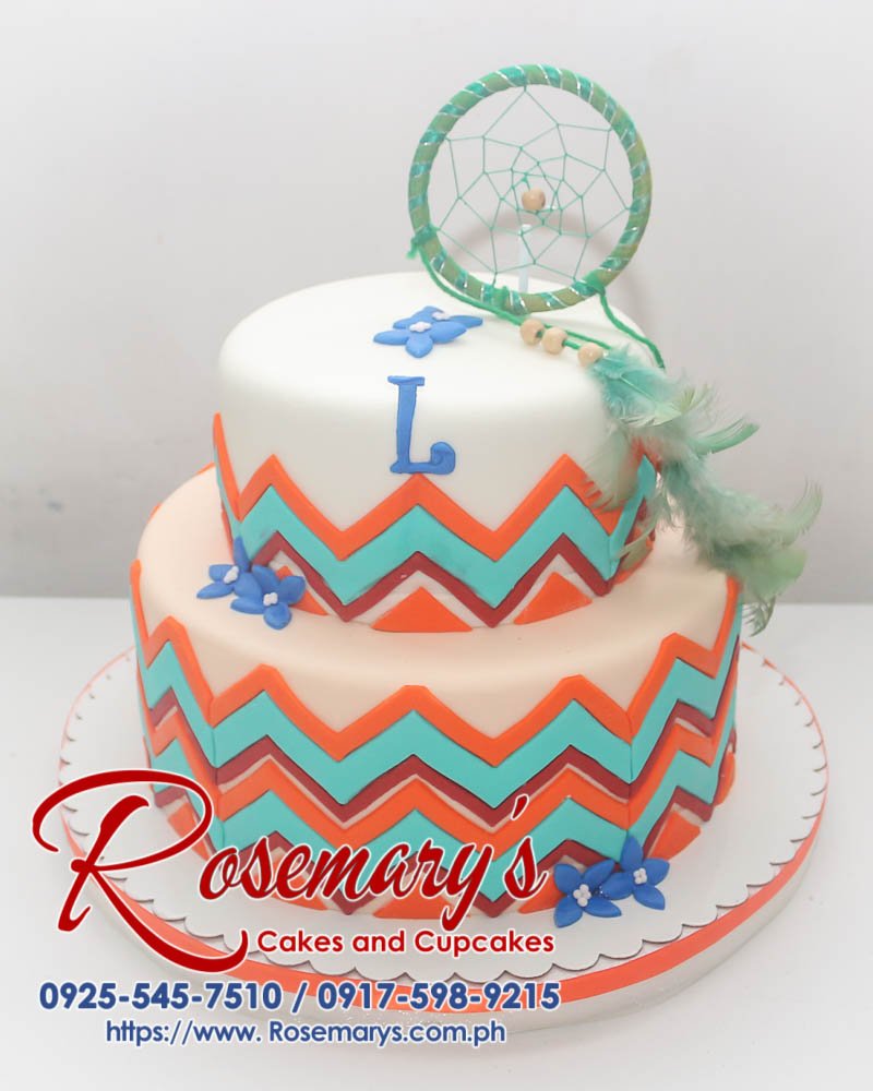 Delicious two-tier dreamcatcher themed cake with intricate white frosting details. Order your custom cake from Rosemary's Cakes! Call 0925-545-7510.