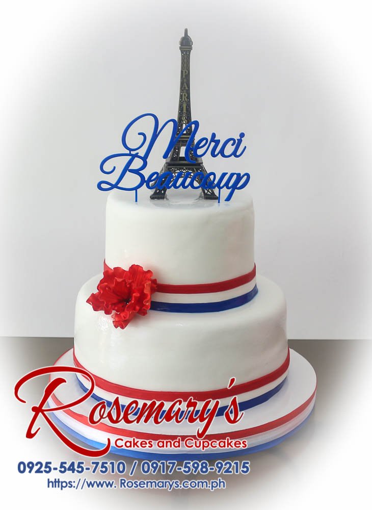 2 Layer France Themed Cake with a 3D printed -Merci Beaucoup- topper Delicious two-tier blue and white cake decorated with a red Eiffel Tower and