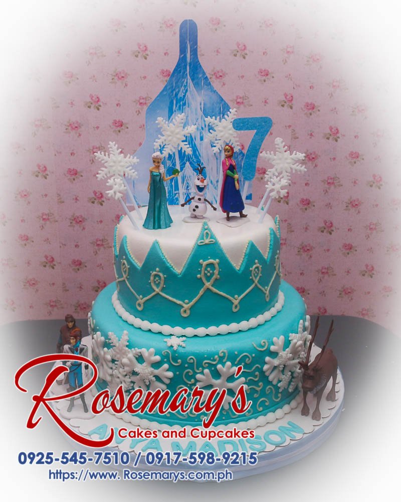 Delicious 2 layer Frozen themed cake featuring Elsa and Anna in blue, created by Rosemary's Cakes. Contact: 0925-545-7510.