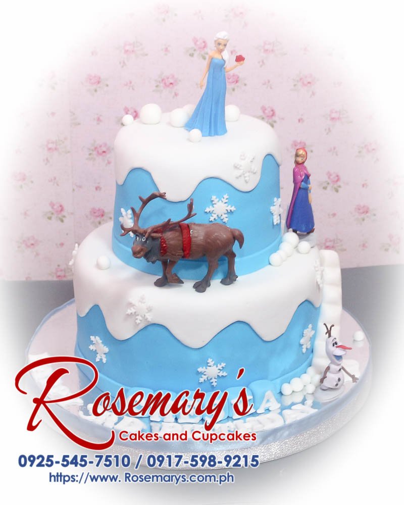 Delicious 2-layer Frozen themed cake with Anna and Elsa accents in blue, crafted by Rosemary's Cakes. Contact: 0925-545-7510.