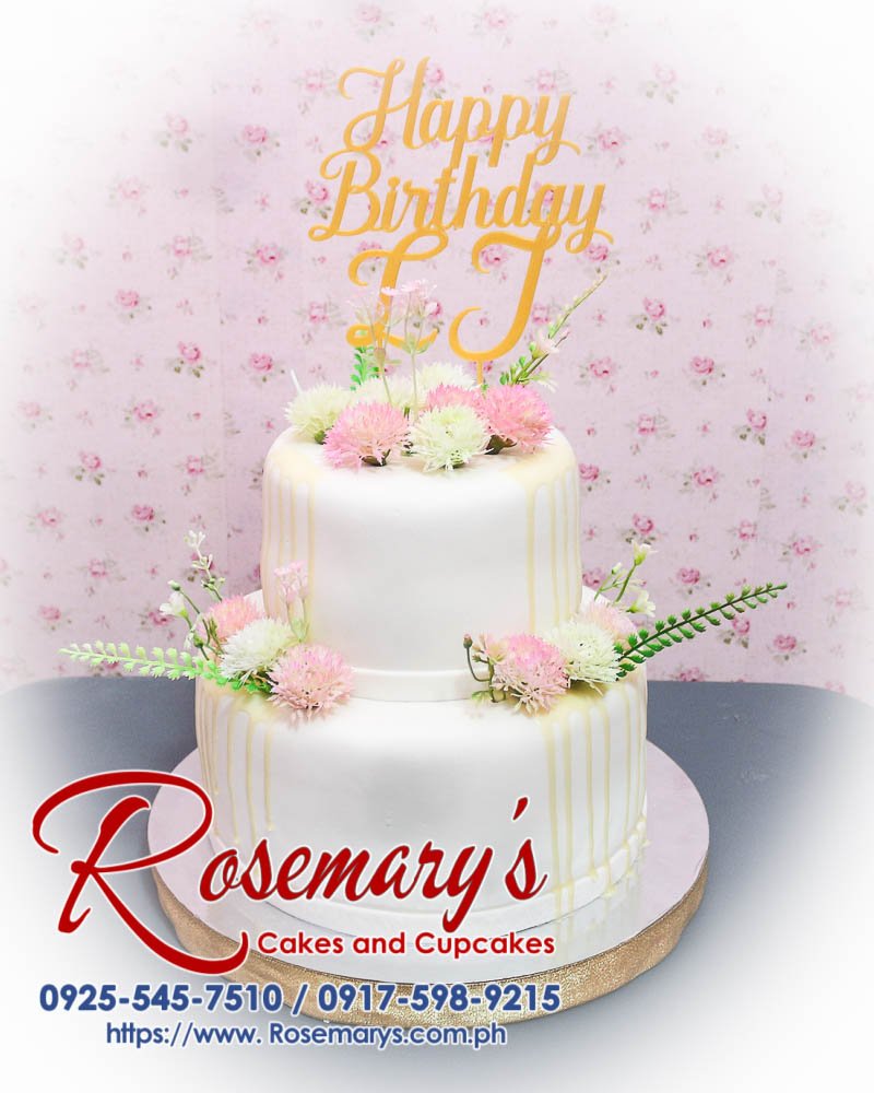 Delicious 2 layer garden themed cake with vibrant flowers and a 3D printed topper. Order from Rosemary's Cakes at 0917-598-9215.