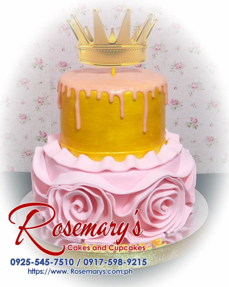 Delicious 2 layer gold and pink floral cake with elegant crown design, perfect for any themed celebration. Rosemary's Cakes 0925-545-7510.