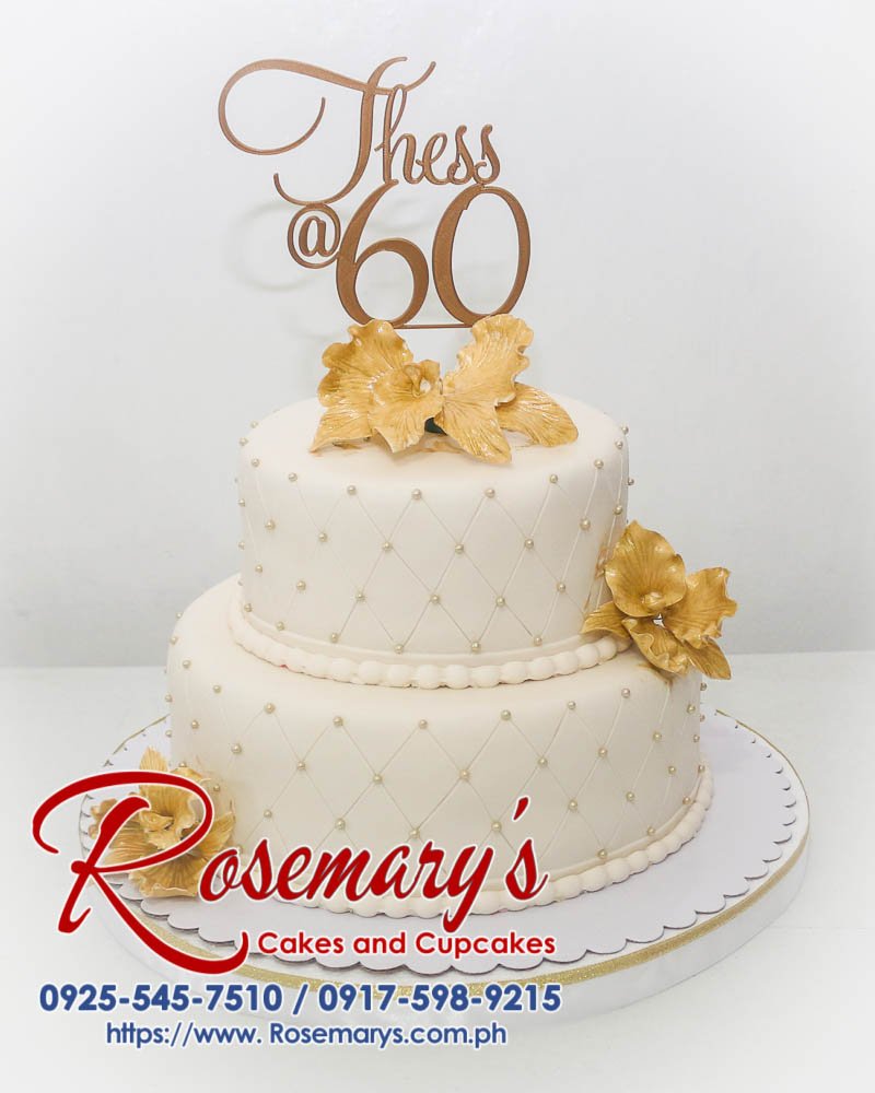 2 Layer Gold Cake For Thess’ 60th Birthday Two-tier gold birthday cake with a 3D printed topper. Order your custom cake from Rosemary's Cakes: 0925-545-7510.
