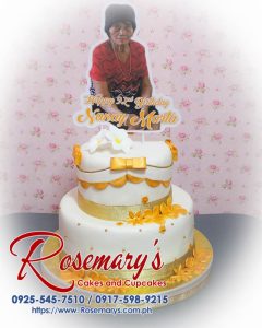Luxurious 2 layer gold and white themed cake, beautifully decorated, perfect for celebrations. Order from Rosemary's Cakes: 0925-545-7510.