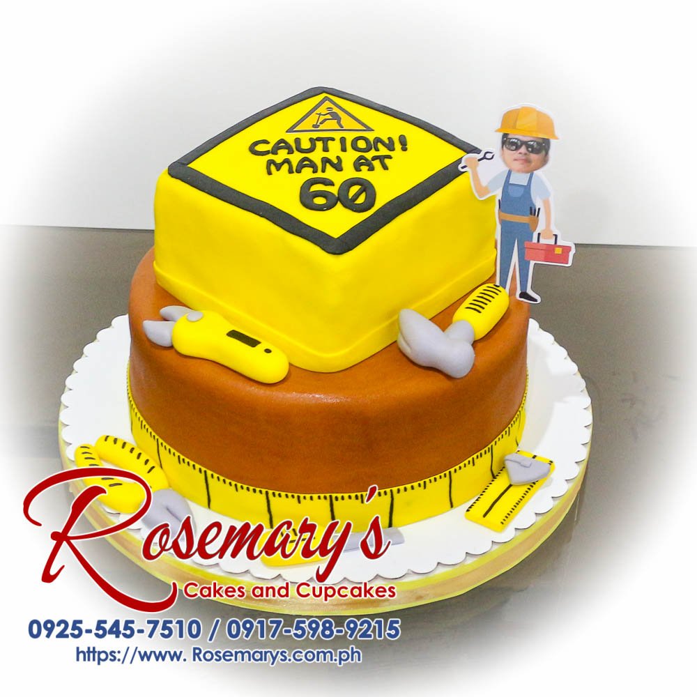 Delicious 2-layer handyman themed cake by Rosemary's Cakes, featuring brown and yellow construction details. Contact: 0925-545-7510.