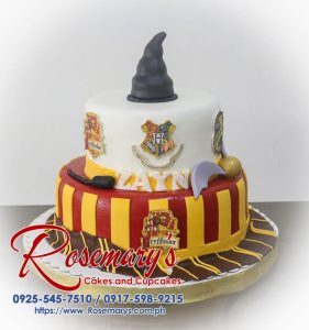 Two-tier black and gold Harry Potter themed cake with Gryffindor accents. Order your custom cakes from Rosemary's Cakes: 0917-598-9215.