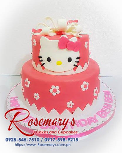 Delicious 2 layer Hello Kitty cake in pink with intricate decorations, perfect for themed celebrations. Rosemary's Cakes, 0925-545-7510.