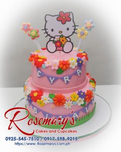 Two-layer Hello Kitty cake with pink frosting and adorable details. Order your custom themed cake from Rosemary's Cakes: 0925-545-7510.