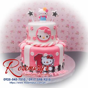 Delicious 2 layer Hello Kitty themed cake by Rosemary's Cakes, featuring pink frosting and charming decorations. Contact: 0925-545-7510.