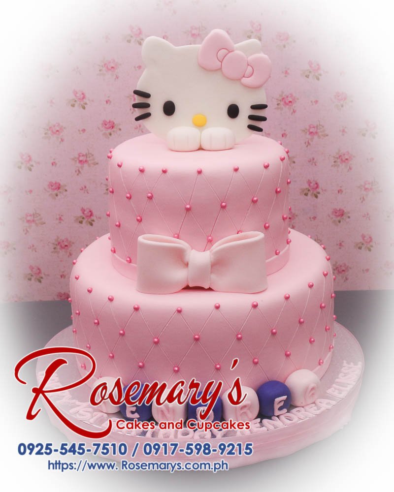 Two-layer Hello Kitty cake decorated with pink icing, ribbons, and delightful details. Order from Rosemary's Cakes at 0925-545-7510.