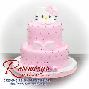 Delicious 2 layer Hello Kitty themed cake in pink with a ribbon, crafted by Rosemary's Cakes. Contact: 0917-598-9215.