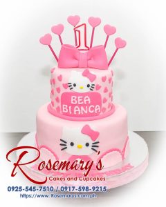 Delicious 2 layer Hello Kitty themed cake adorned with pink ribbons, handcrafted by Rosemary's Cakes. Contact: 0925-545-7510.