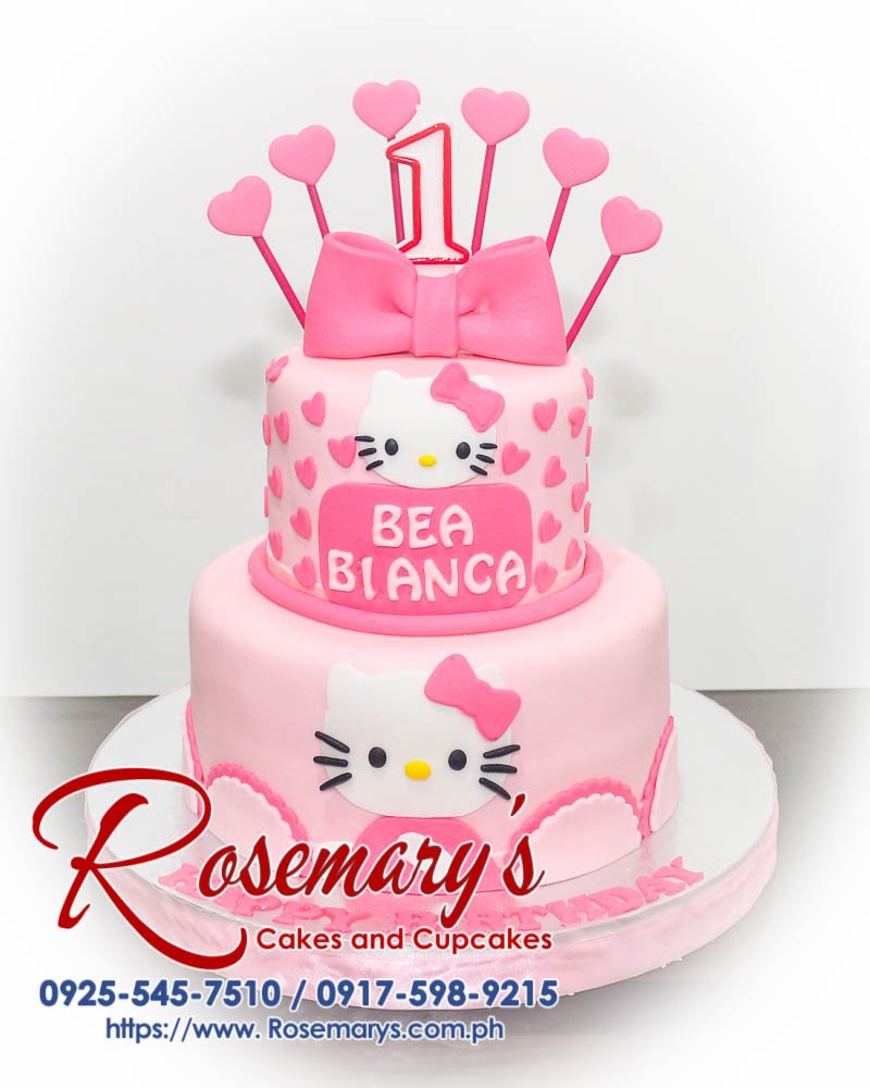 Delicious 2 layer Hello Kitty themed cake adorned with pink ribbons, handcrafted by Rosemary's Cakes. Contact: 0925-545-7510.