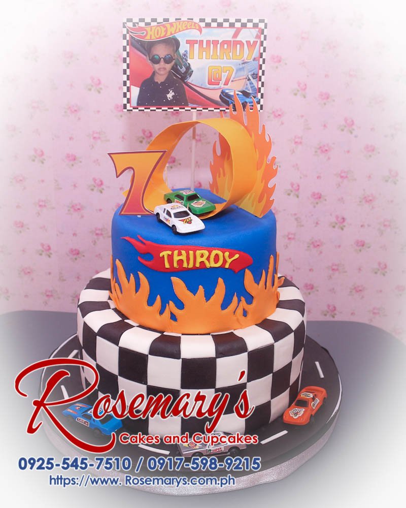Delicious 2 layer Hot Wheels cake featuring vibrant black and blue design. Order now at Rosemary's Cakes, 0917-598-9215.
