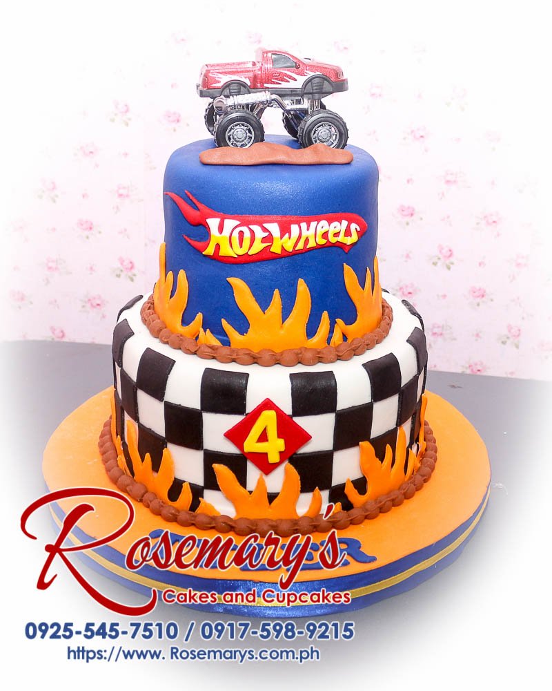 2 Layer Hot Wheels Themed Cake for Tyler Delicious 2 layer Hot Wheels themed cake in blue and orange, featuring a monster truck. Rosemary's Cakes, 0925-545-7510.