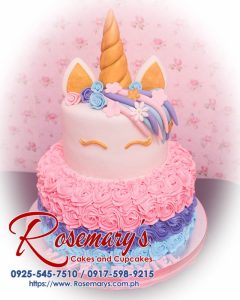 Two-layer icing unicorn cake featuring pink rosettes and gold accents. Perfect for any celebration. Rosemary's Cakes, 0925-545-7510.