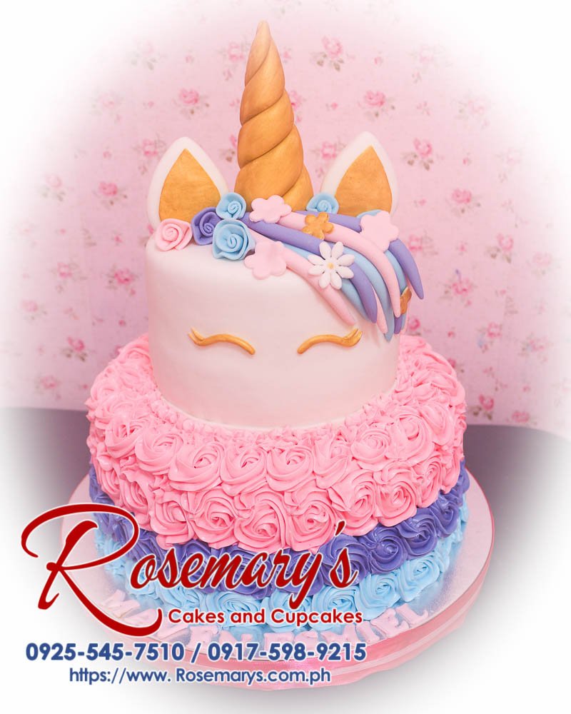 2 Layer Icing Unicorn Cake for Maven Esmiel Two-layer icing unicorn cake featuring pink rosettes and gold accents. Perfect for any celebration. Rosemary's Cakes, 0925-545-7510.