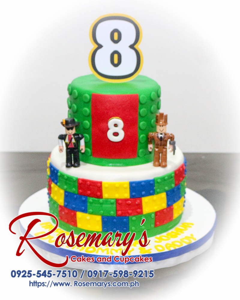 Delicious 2 layer green Lego themed cake by Rosemary's Cakes, perfect for any celebration. Contact: 0917-598-9215.