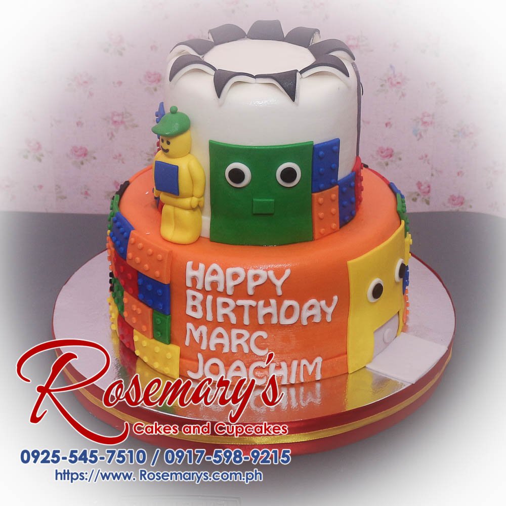 2 Layer Lego Themed Cake for Marc Joachim Delicious 2 layer Lego themed cake in vibrant orange, perfect for celebrations. Order from Rosemary's Cakes at 0925-545-7510.