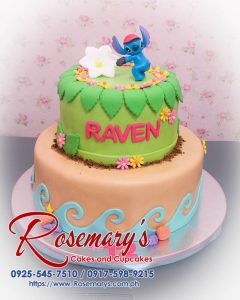 Delicious 2 layer Lilo and Stitch themed cake by Rosemary's Cakes, featuring vibrant green and brown colors. Call 0925-545-7510.