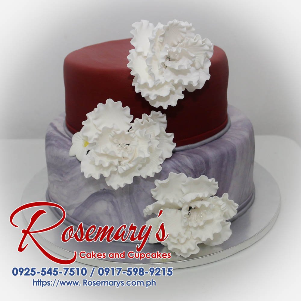 2 Layer Maroon and Marble Cake Delicious two-tier maroon and marble cake with intricate design. Order yours from Rosemary's Cakes! Call 0917-598-9215.
