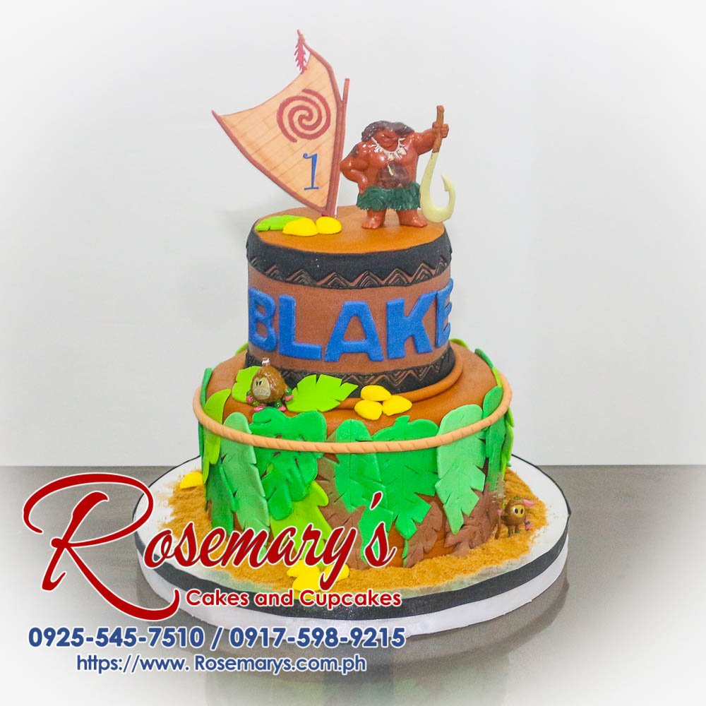 Delicious 2-layer brown cake decorated with a Maui and Moana theme. Perfect for birthdays! Order yours from Rosemary's Cakes: 0925-545-7510.