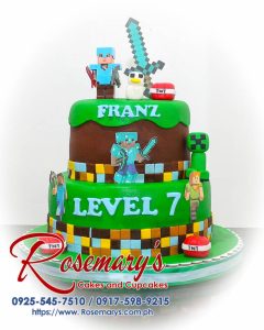 2 layer Minecraft themed cake with brown and green frosting, detailed decor, and delicious layers. Order from Rosemary's Cakes, 0925-545-7510.