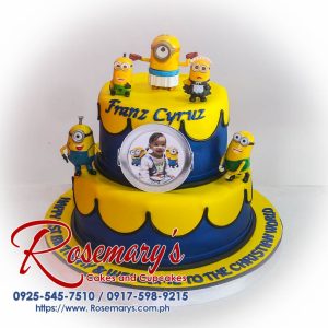 Two-layer minion themed cake with vibrant yellow and blue frosting, perfect for birthdays! Order yours from Rosemary's Cakes: 0917-598-9215.