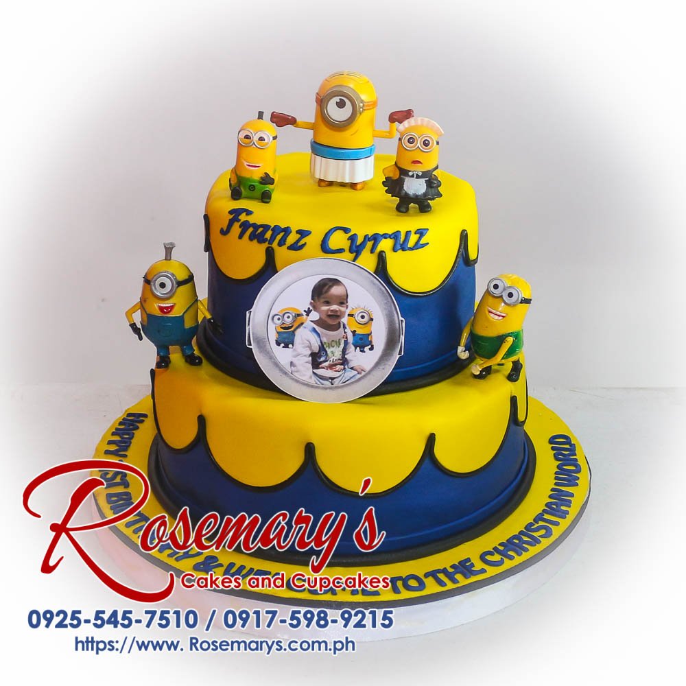 Two-layer minion themed cake with vibrant yellow and blue frosting, perfect for birthdays! Order yours from Rosemary's Cakes: 0917-598-9215.