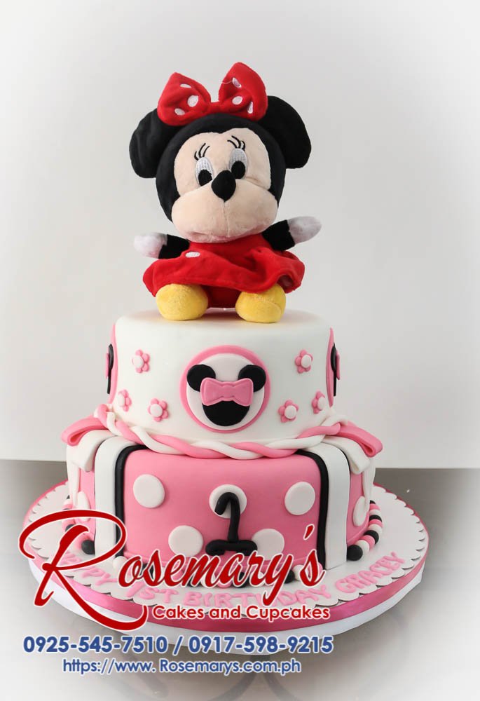 Two-tier Minnie Mouse cake with red and black polka dots and iconic ears. Order your custom cake from Rosemary's Cakes! Call 0925-545-7510.