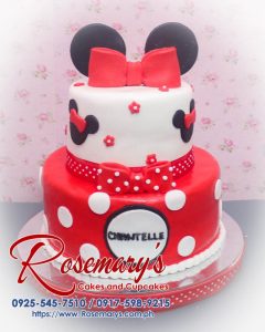 Delicious 2-layer Minnie Mouse cake with red ribbon detailing, perfect for themed celebrations. Order from Rosemary's Cakes at 0917-598-9215.