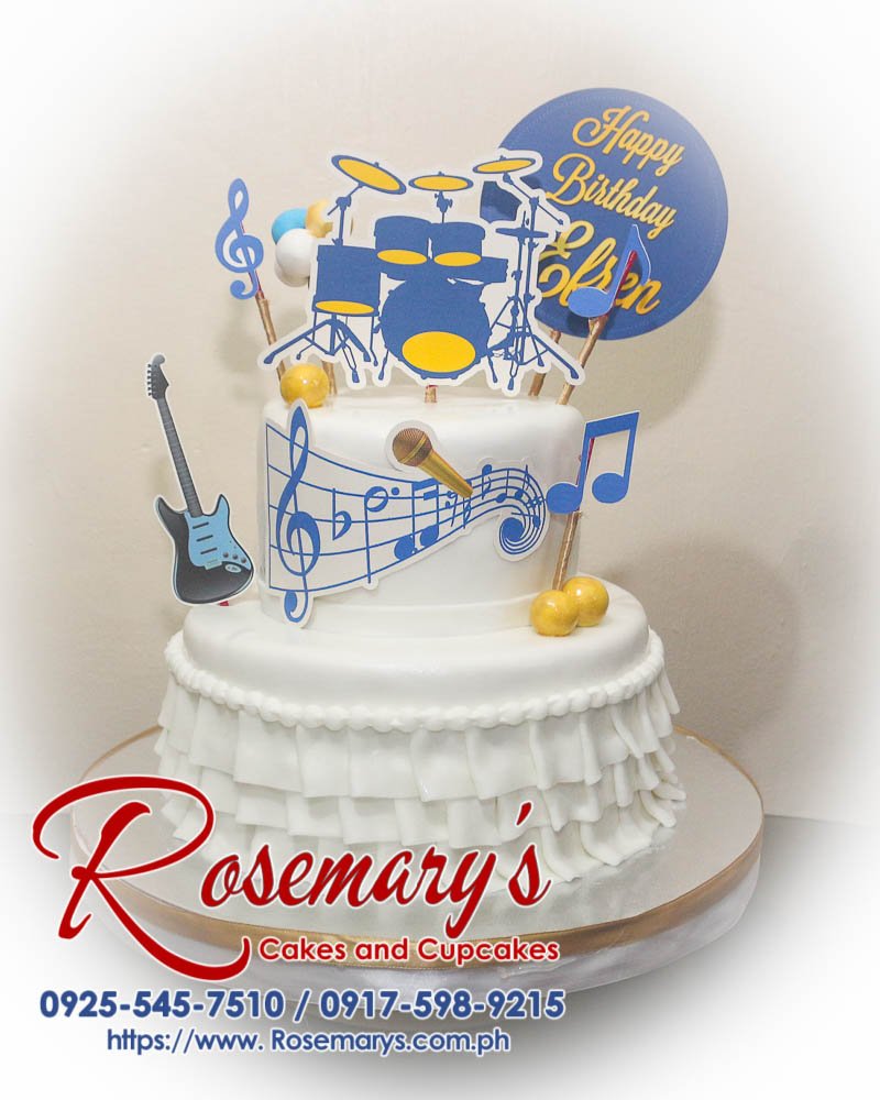 Delicious 2-layer music themed cake adorned with musical notes and instruments, crafted by Rosemary's Cakes. Contact: 0917-598-9215.