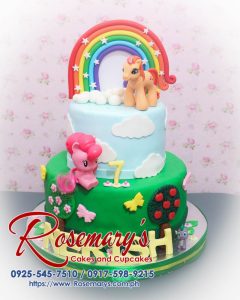 Delicious 2 layer My Little Pony themed cake in blue and green, decorated with a rainbow. Order from Rosemary's Cakes - 0917-598-9215.