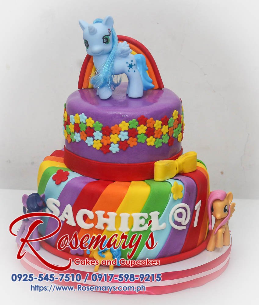 Two-tier purple and rainbow My Little Pony themed cake with whimsical decorations. Made by Rosemary's Cakes (0917-598-9215)