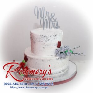 Two-tiered naked wedding cake with delicate buttercream frosting and fresh berries. Order your dream cake from Rosemary's Cakes! Call 0917-598-9215.
