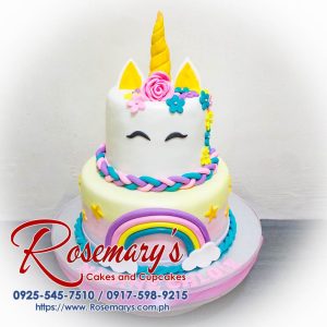 Two-layer pastel rainbow unicorn cake with shimmering buttercream frosting and a golden horn. Order your dream cake from Rosemary's Cakes: 0917-598-9215
