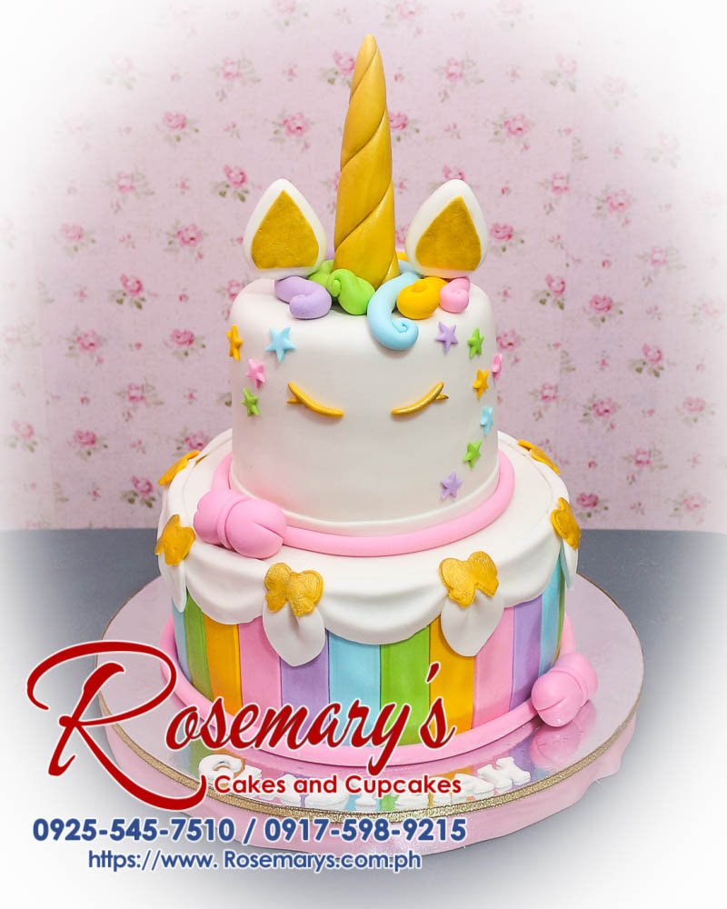 Pastel unicorn-themed 2 layer cake with gold accents, perfect for celebrations. Order from Rosemary's Cakes at 0917-598-9215.