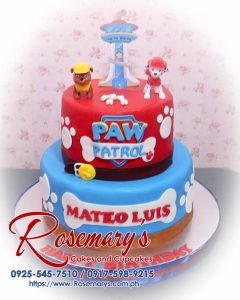 Delicious 2 layer Paw Patrol themed cake in blue and red, perfect for celebrations. Order from Rosemary's Cakes: 0925-545-7510.
