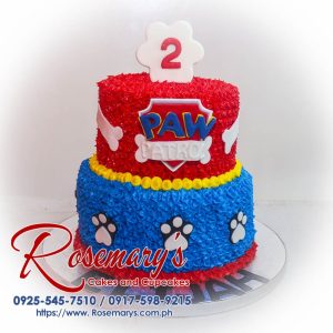 Two-layer vanilla cake decorated with vibrant blue and red icing, featuring a fun Paw Patrol theme. Order your custom cake from Rosemary's Cakes, call 0925-545-7510!