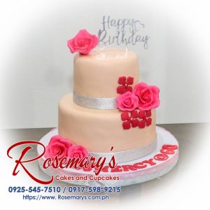 Delicious two-layer peach and pink cake decorated with delicate florals. Perfect for birthdays or special occasions! Rosemary's Cakes | 0925-545-7510