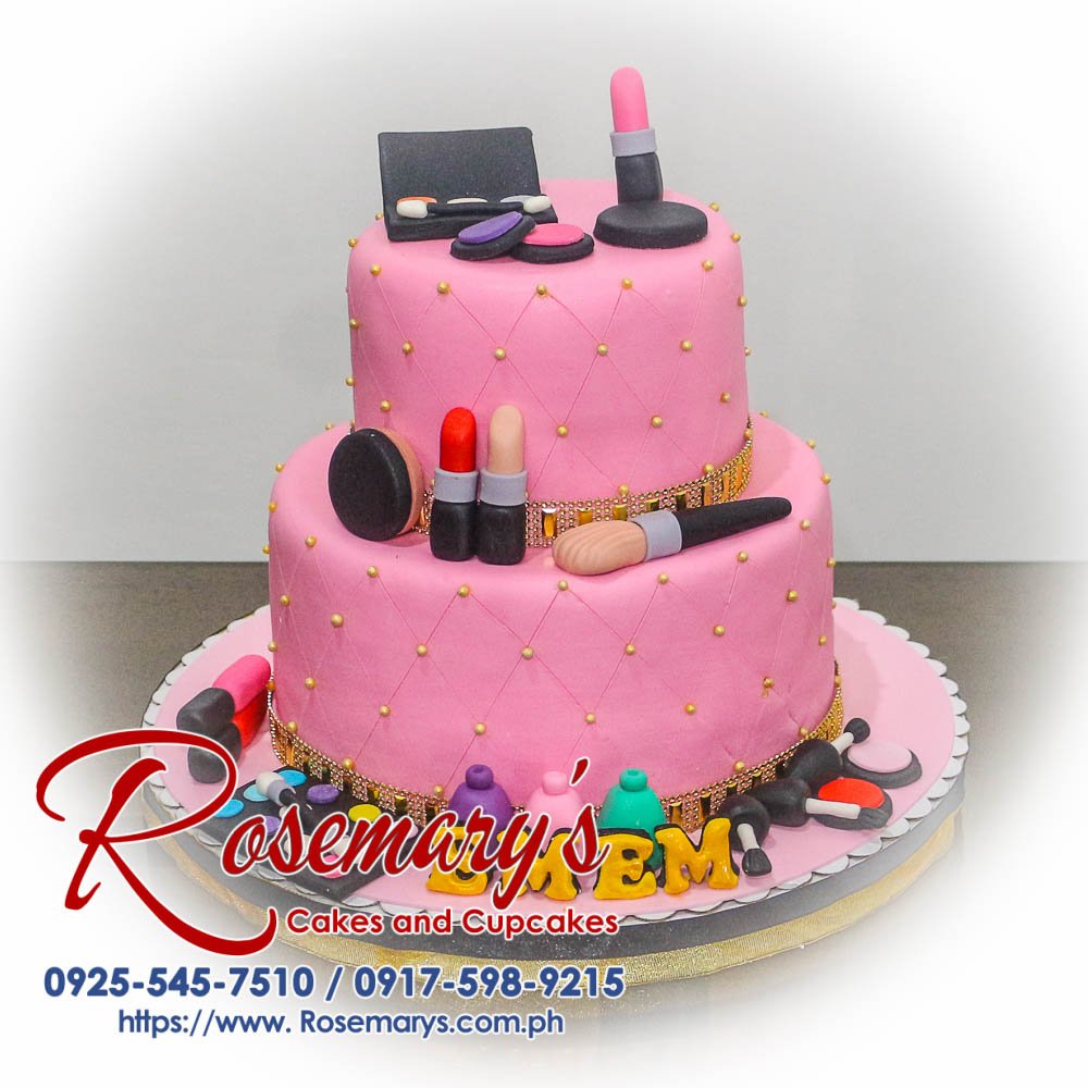 Two-layer pink cake decorated with edible makeup brushes and lipsticks. Perfect for birthdays! Order yours from Rosemary's Cakes, 0925-545-7510.