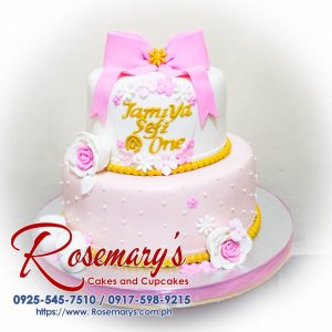 Delicious 2-layer pink and gold themed cake adorned with pink roses and a ribbon. From Rosemary's Cakes. Contact: 0917-598-9215.