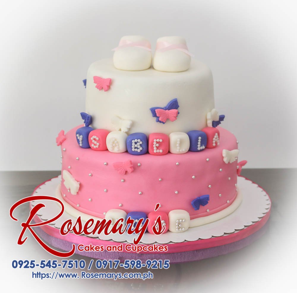 2 Layer Pink and White Cake with Fondant Shoes and Blocks Toppers for Ysabella Hope’s Christening Two-tier pink and white christening cake adorned with fondant shoes and blocks. Custom cakes by Rosemary's Cakes: 0917-598-9215.